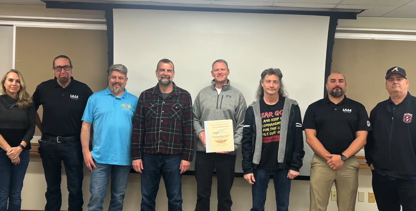 IAM Union bargaining committee posing for a group photo.