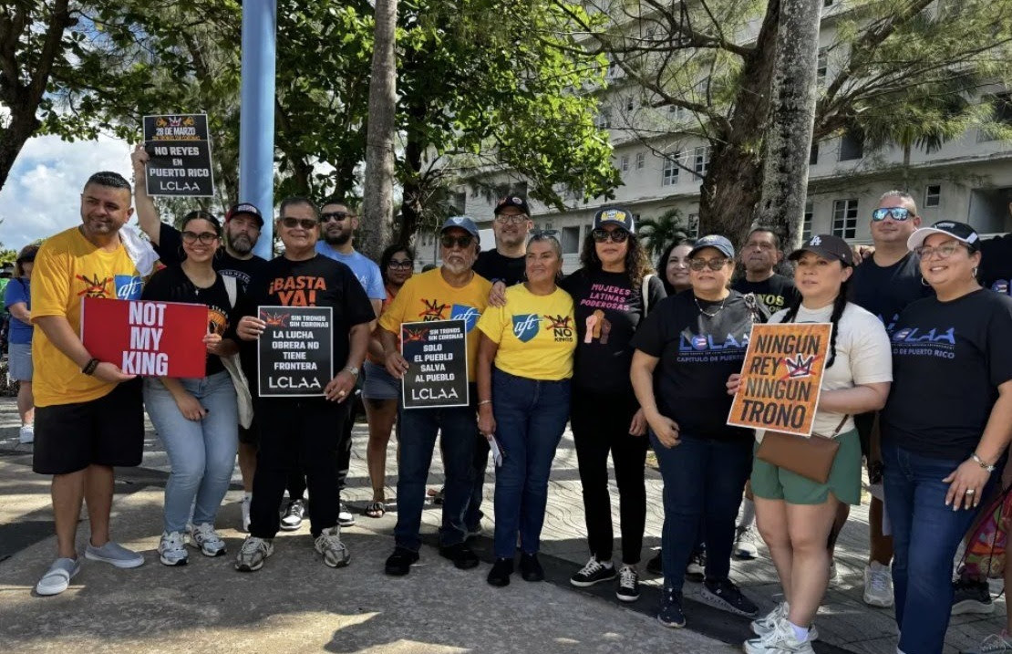 AFT Executive Vice President Evelyn DeJesus (center, yellow shirt) poses with AFT and Labor Council for Latin American Advancement members at the No Kings event in Puerto Rico.