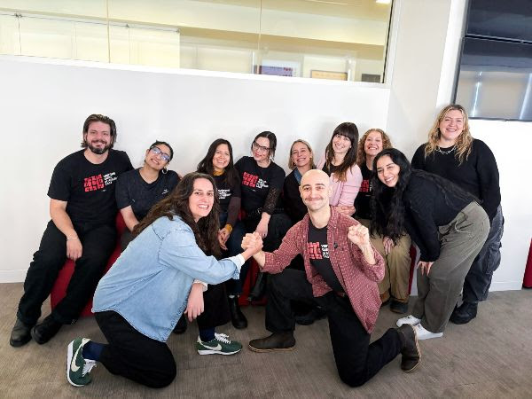 Huffpost Union members pose for a group picture together.