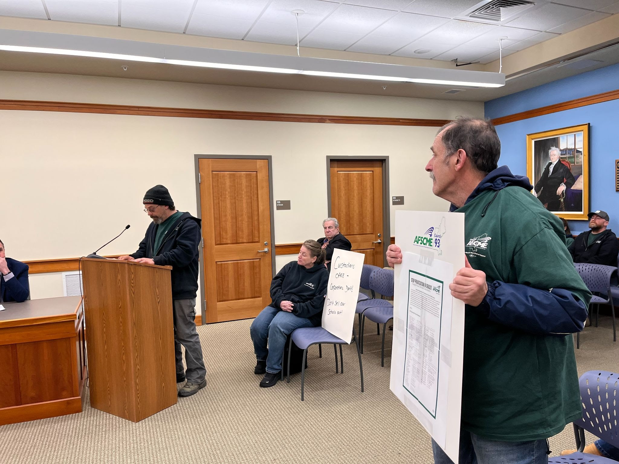 AFSCME members testifying at a meeting.