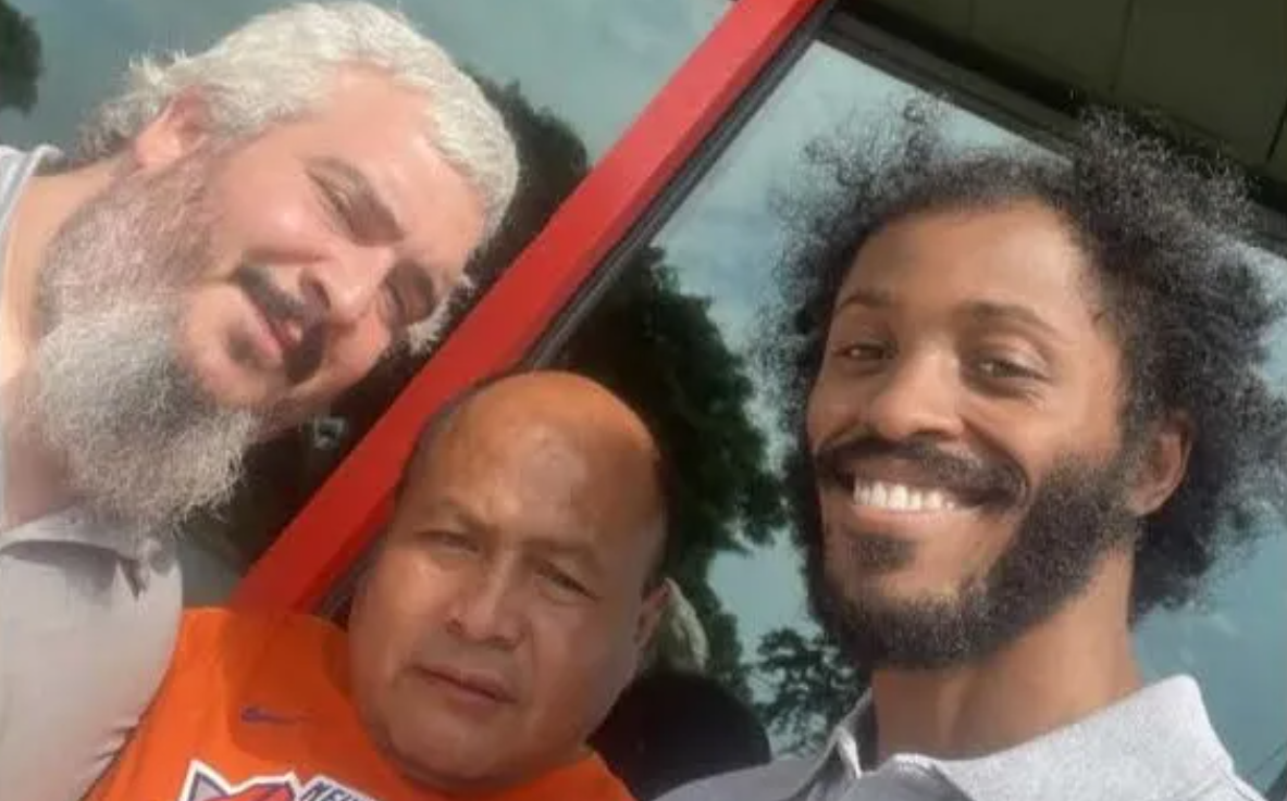 AutoZone workers pose for a group picture.