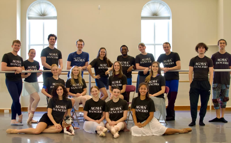 Dayton Ballet dancers posing for a group picture inside a ballet studio.